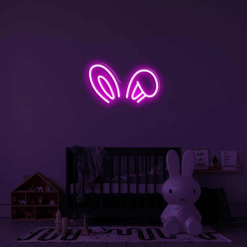 Logotipo de neón brillante en 3D en una pared - orejas de conejo