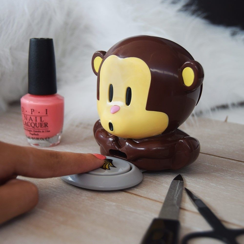 Secador de esmalte de uñas con forma de mono
